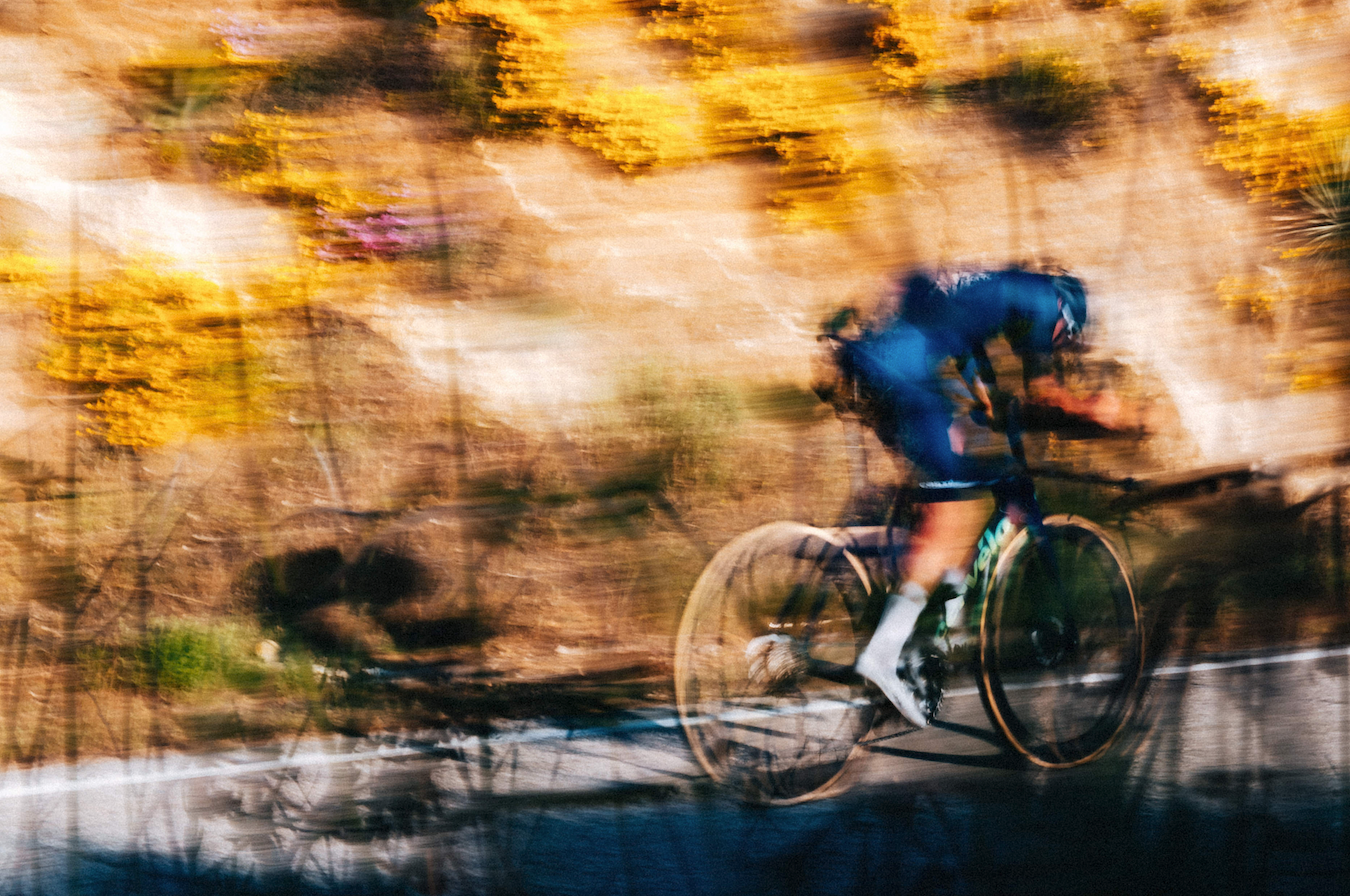 a man riding a cervelo p5 time trial bicycle on the road