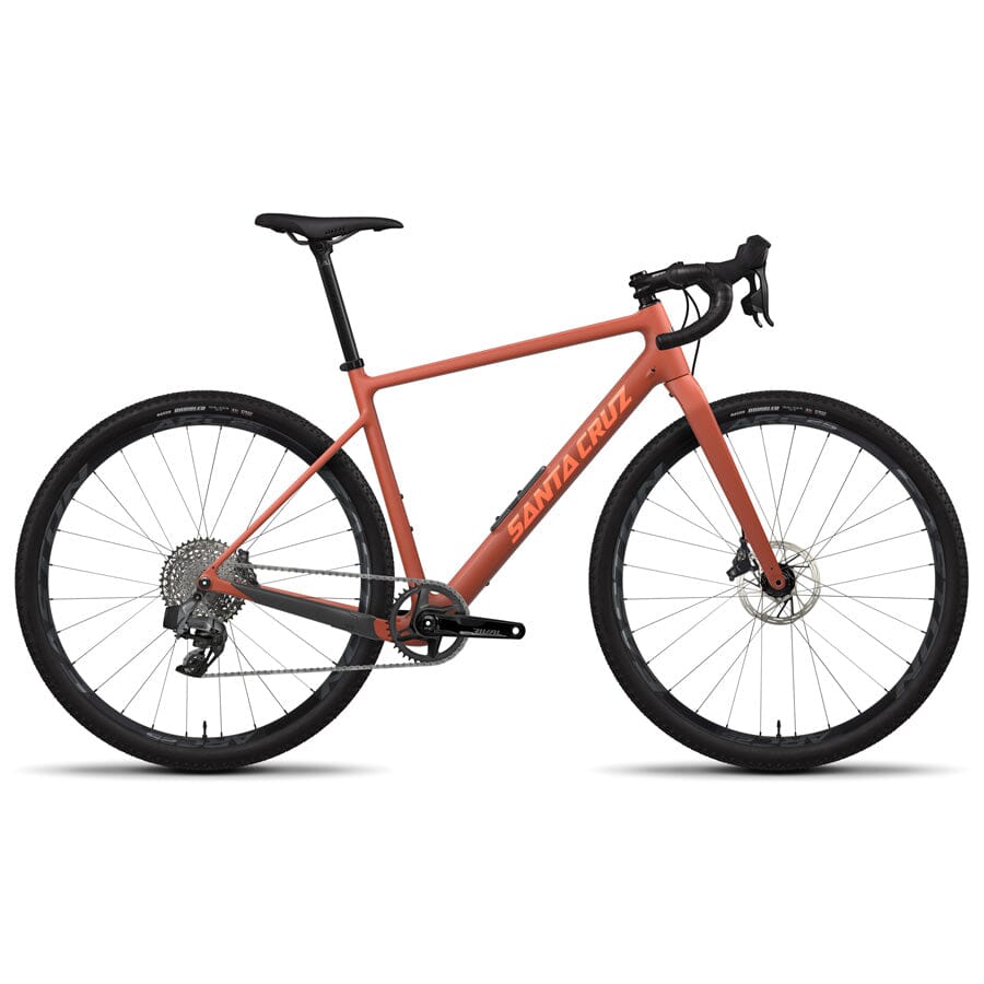 A Red Santa Cruz Stigmata 4 CC bike with orange lettering on the frame and drop handlebars