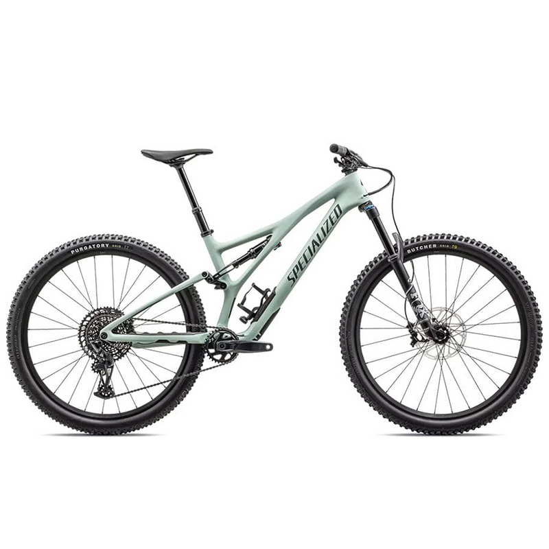 A light green Specialized Stumpjumper mountain bike with big tires