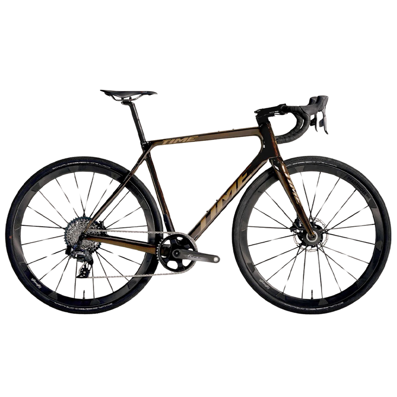 A brown TIME ADHX gravel bike with gold lettering and drop handlebars