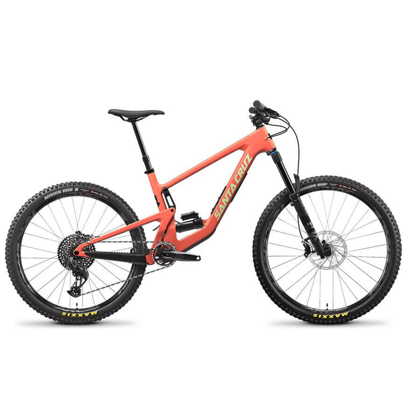 A orange Santa Cruz mountain bike with knobby tired and a flat handlebar