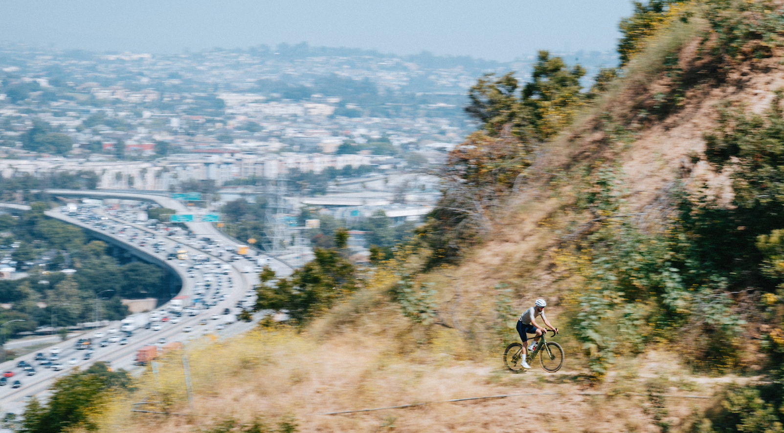 a man riding a cervelo rouvida electric bicycle on a gravel path